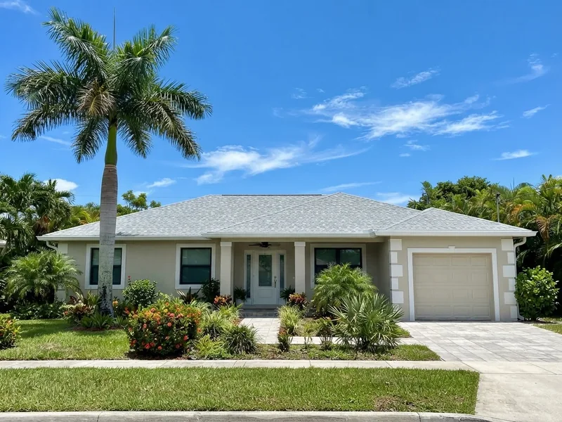 After: new gray shingle roof on a South Florida home