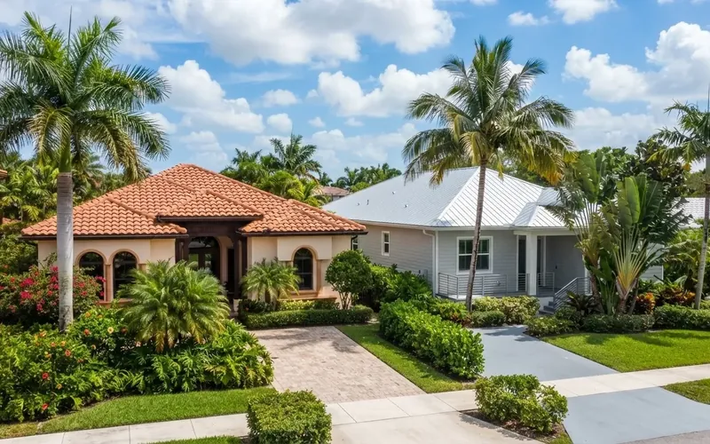Clay tile roof on a South Florida home framed by palm trees